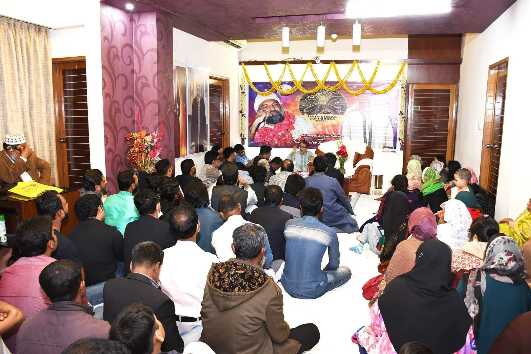 Community members gathered at an MFI spiritual event in Bangladesh, 2023